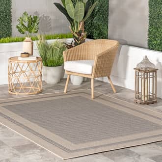 6' 7" x 9' Bordered Solid Indoor/Outdoor Rug secondary image